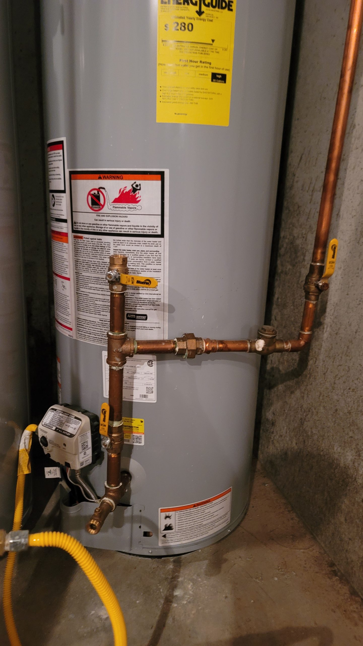 Hot water heater, hot water recirculating system, thermosyphon